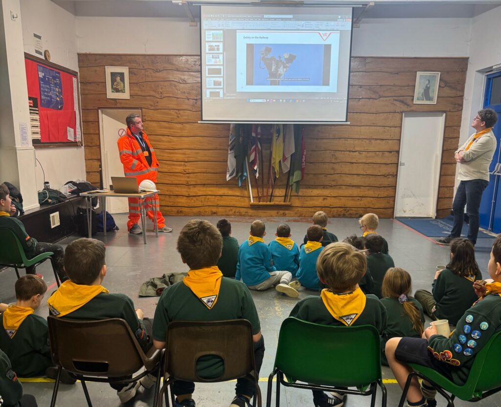 Two colleagues deliver a Rail Safety Talk to a group of Cubs from the 1st Ripley Scout Group, using interactive activities to teach railway safety.